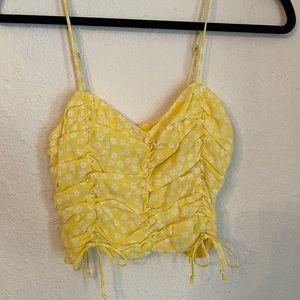 Cute and fun yellow floral crop top. Perfect for summer!